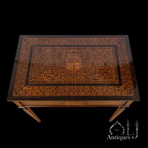 An Exceptional and Rare Indo-Portuguese Three-Drawer Writing Table, Richly Decorated in Contrasting-Wood Marquetry and Inlay with a Crowned Composite European Coat of Arms, Confronted Mythical Birds and Elaborate Floral and Foliate Arabesques, Made for a European, Probably Portuguese Patron, Western India, Probably Gujarat or Goa, 17th Century